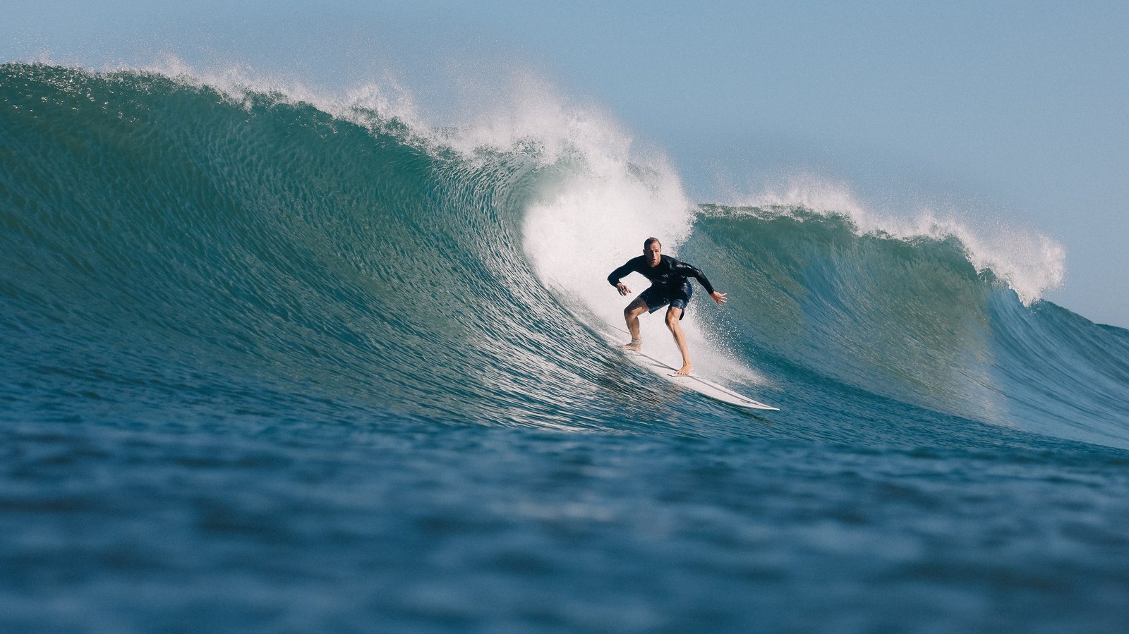 Surfer on a clean barrel