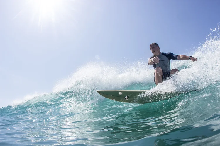 Surfer with sun flare